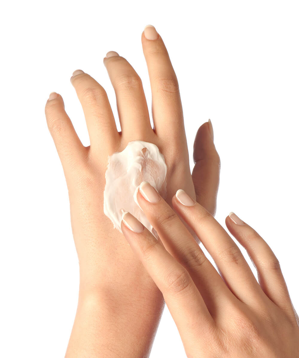 hands applying skin cream