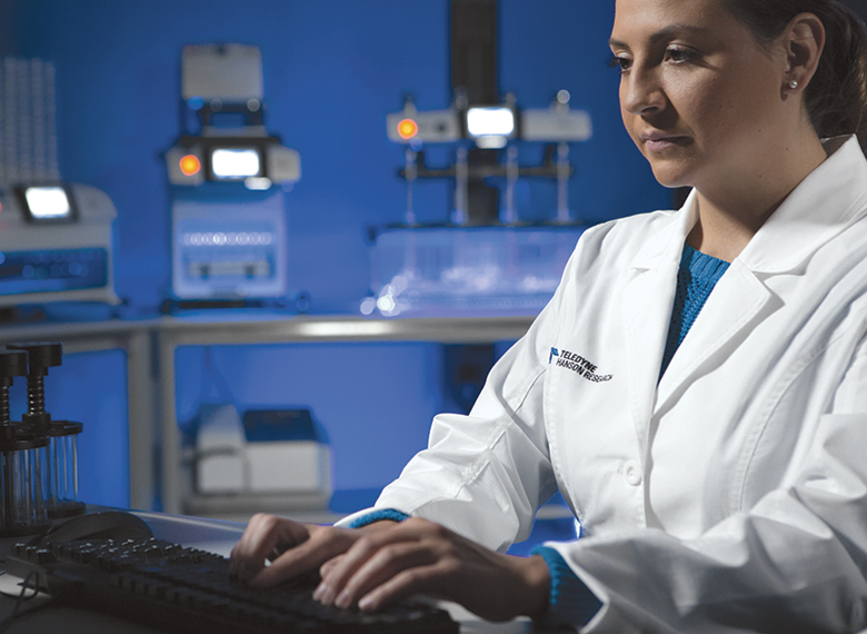 scientist typing on computer keyboard